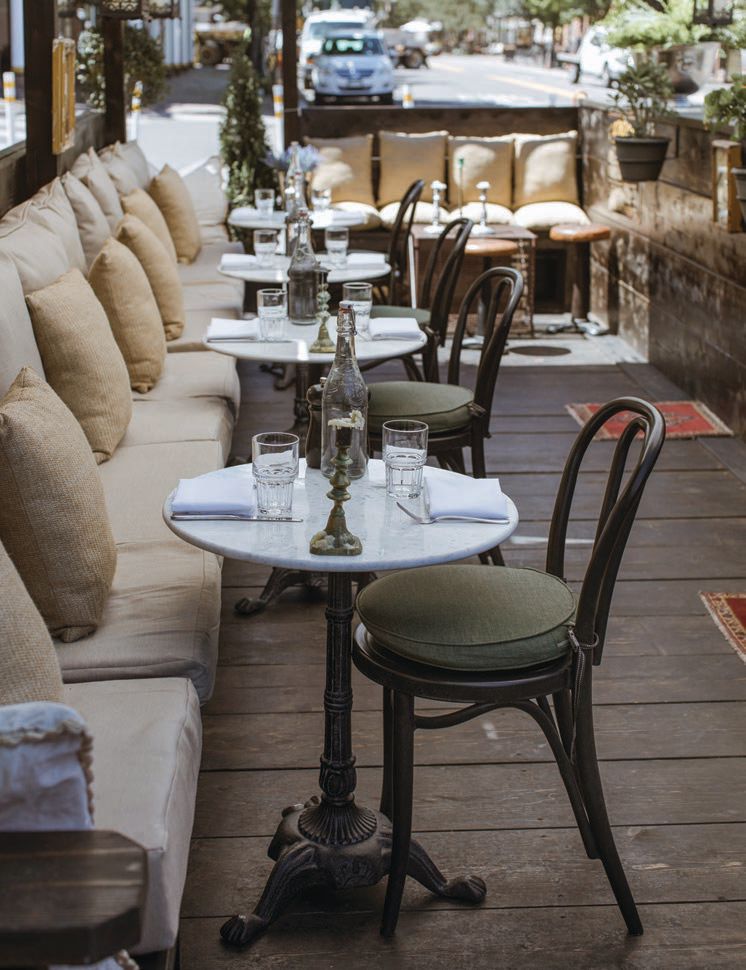 Spacious, sun-splashed and comfy, the side street patio at The French Alpine Bistro-Crêperie du Village PHOTO BY AHRLING PHOTOGRAPHY