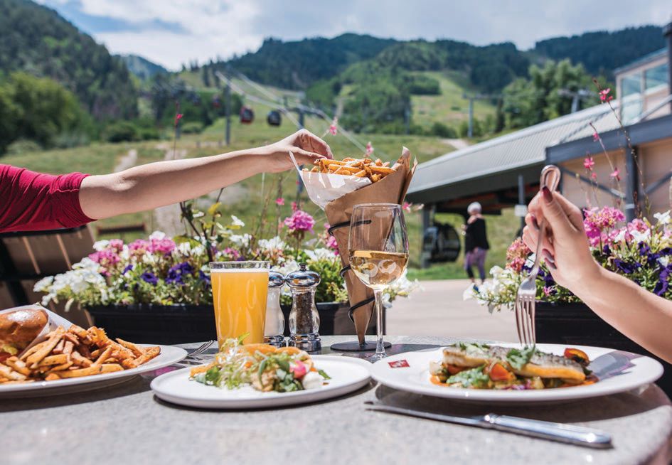 Slopeside alfresco dining at Ajax Tavern, with truffle fries and rosé. PHOTO BY ARHLING PHOTOGRAPHY
