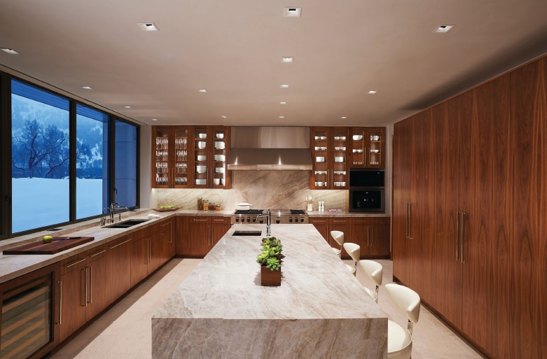 This 500-square-foot kitchen in Aspen’s East End features a waterfall island topped with natural Taj Mahal quartzite. PORTRAIT COURTESY OF POSS ARCHITECTURE