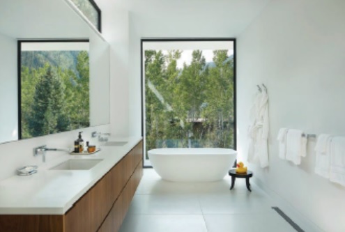 The main bathroom features a Corian-topped walnut vanity and a Badeloft Corian tub. PHOTOGRAPHED BY DAVID MARLOW