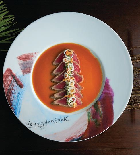 Tuna tataki topped with mustard sumiso sauce and pickled wasabi on a plate designed by the chef’s artist mother FOOD PHOTO BY GIOVANNI LEDON