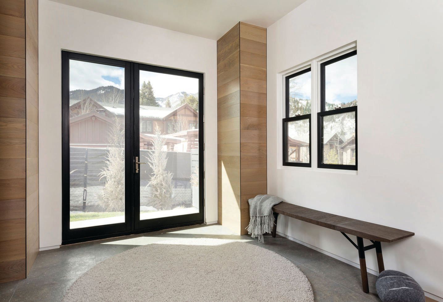 Made completely of glass, the door allows the light to flow into the space. PHOTO COURTESY OF KAREN WHITE INTERIOR DESIGN