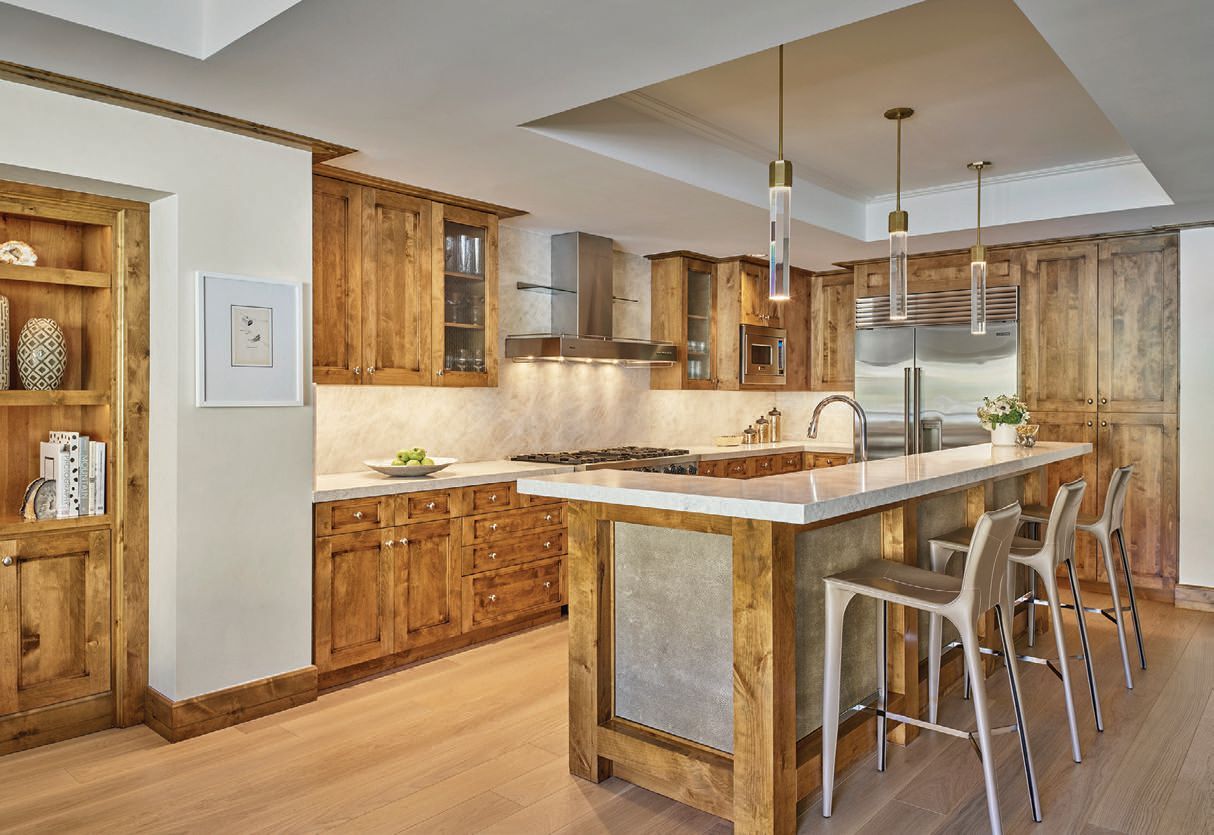 the residences’ fully appointed open-air kitchens were upgraded with white quartzite counters and backsplashes, as well as new appliances. PHOTO COURTESY OF THE LITTLE NELL