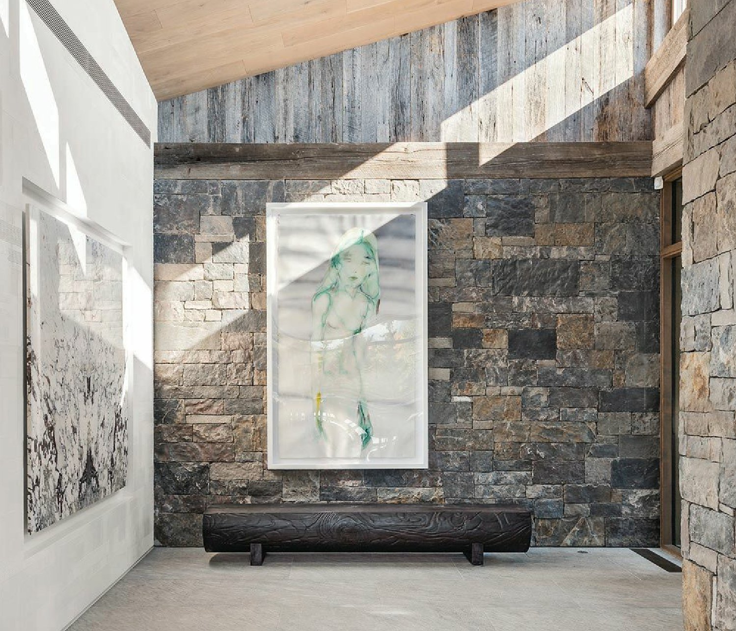 Stonework and artwork define the entry. Photographed by Michael Brands and Brooke Casillas