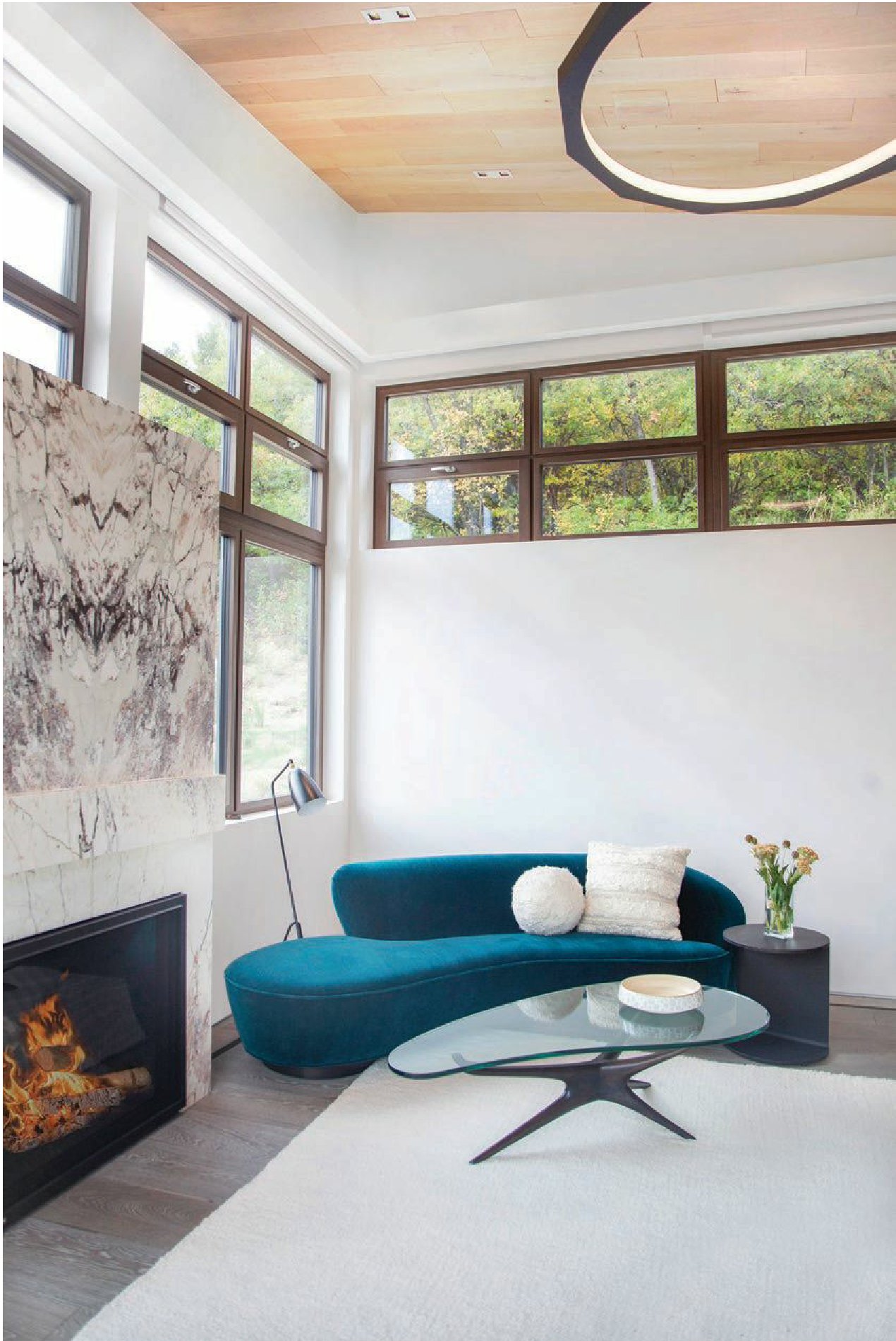 The main bedroom features a custom marble slab above the fireplace Photographed by Michael Brands and Brooke Casillas