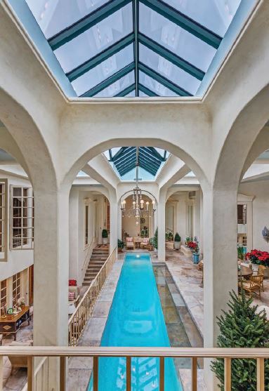 The indoor lap pool is part of a home gym. PHOTO COURTESY OF: SLIFER SMITH & FRMAPTON REAL ESTATE