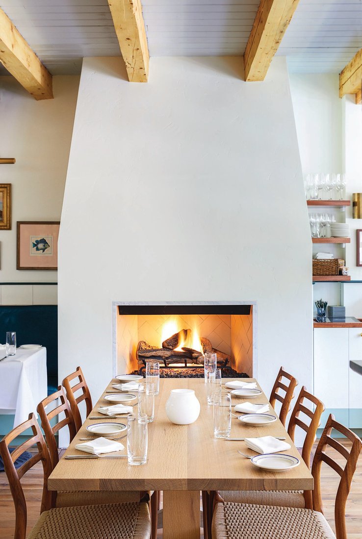A cozy table for six in front of the fireplace is a hot ticket at Clark’s Aspen. PHOTO COURTESY OF CLARK’S ASPEN