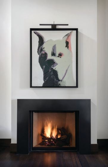 A custom steel surround fireplace and Andy Warhol’s art warm the entry of this Aspen residence on Red Mountain. PHOTO BY AARON LEITZ